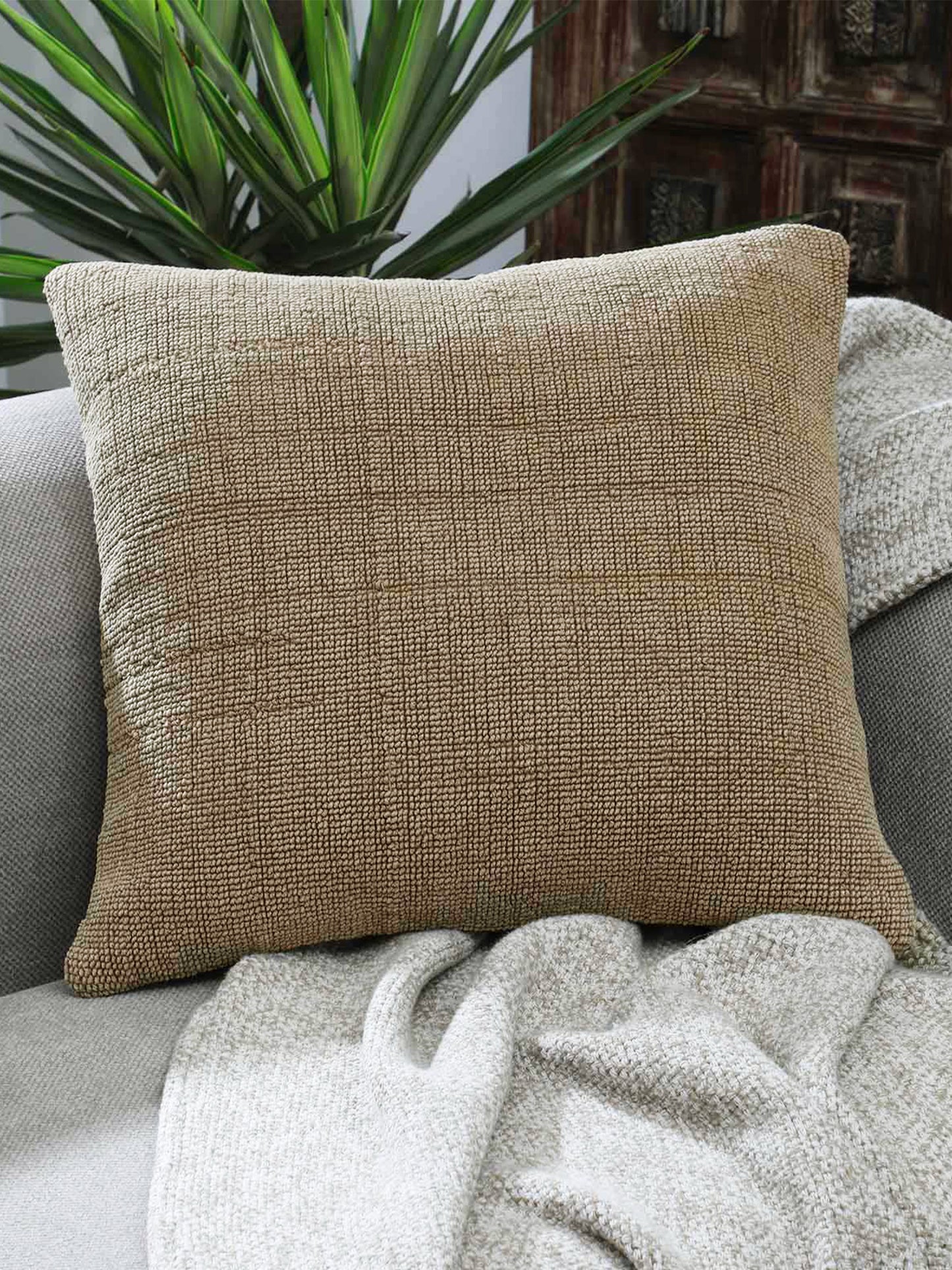 Architectural beige cushion styled in modern interior