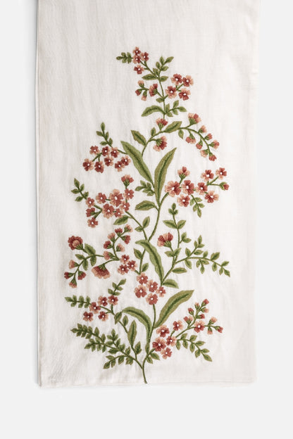 Close-up of embroidery detail on table runner