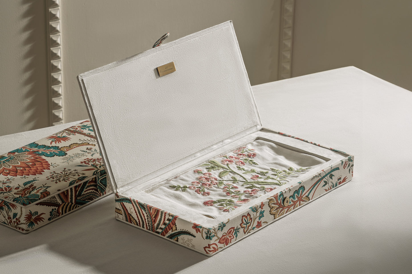 Long linen table runner with coral embroidery accents in fabric gift box