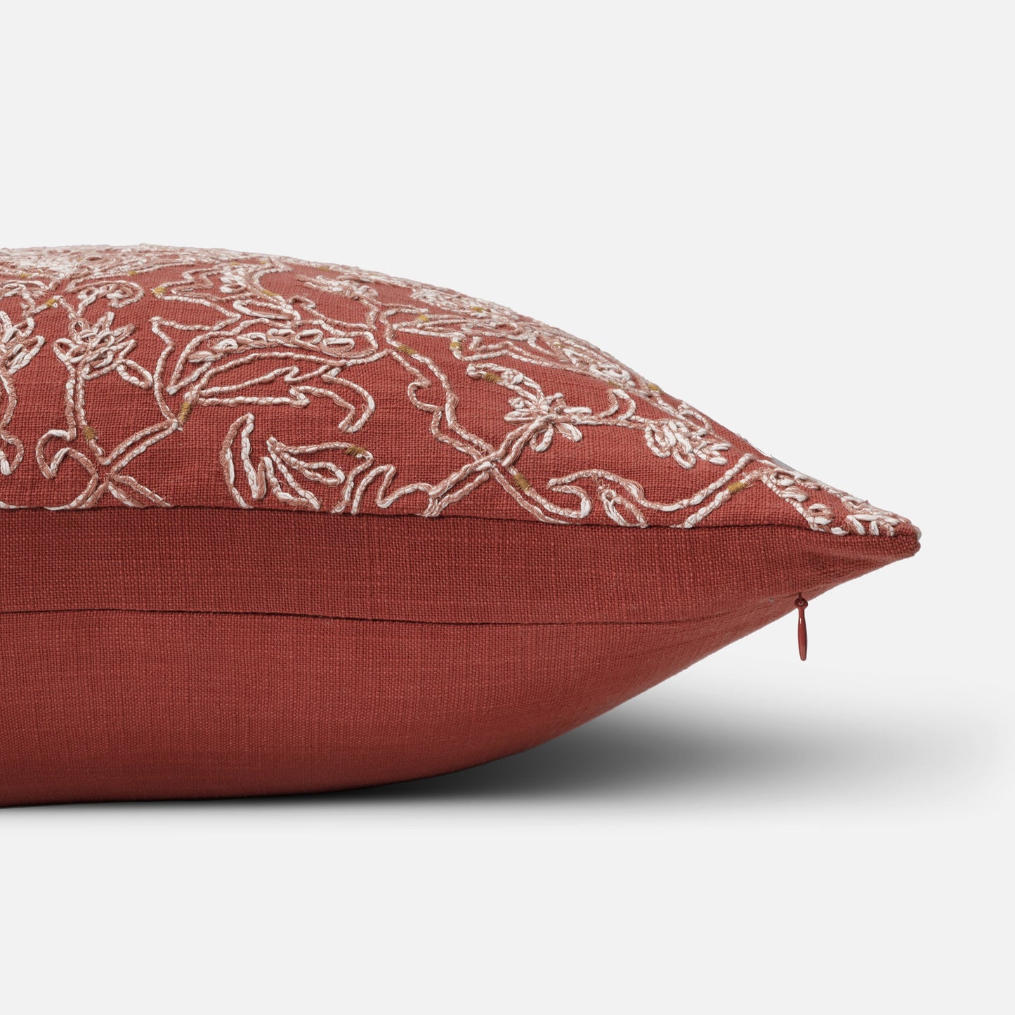 Warm coral accent cushion for modern interiors