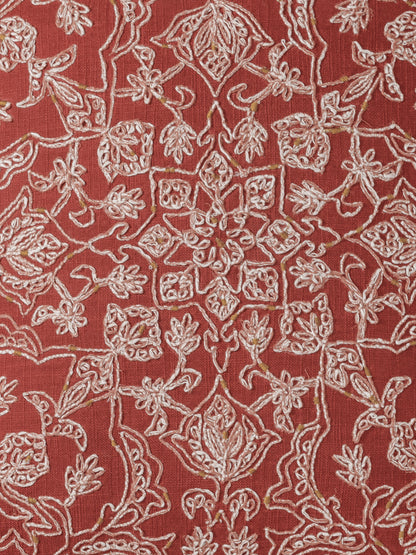 Close-up of stitch on cotton slub texture on coral pillow