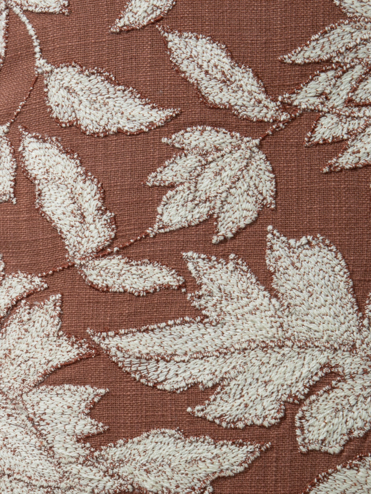 Close-up of textured cotton slub fabric with stitching