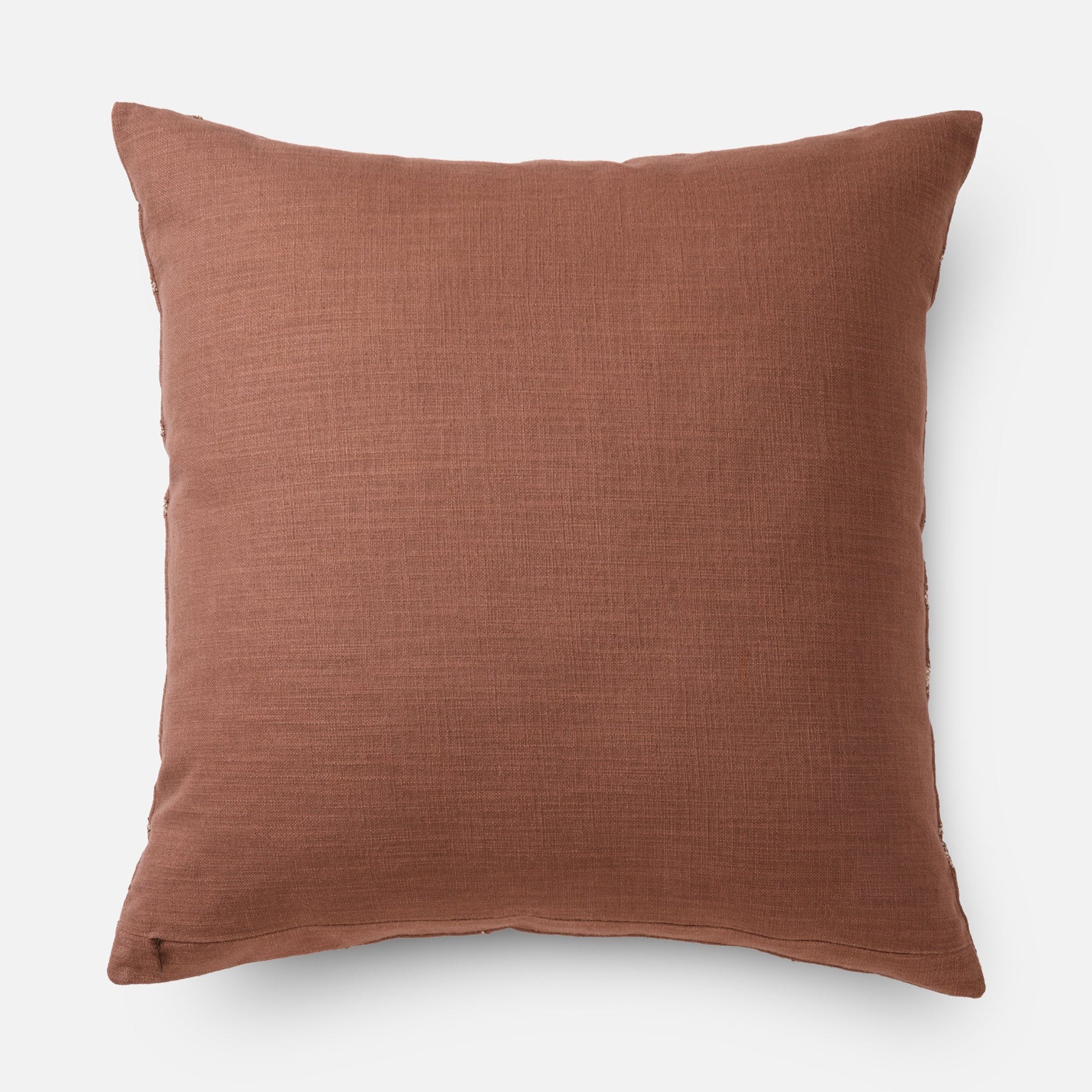 Modern rust coloured cushion for interiors (back side of cushion)