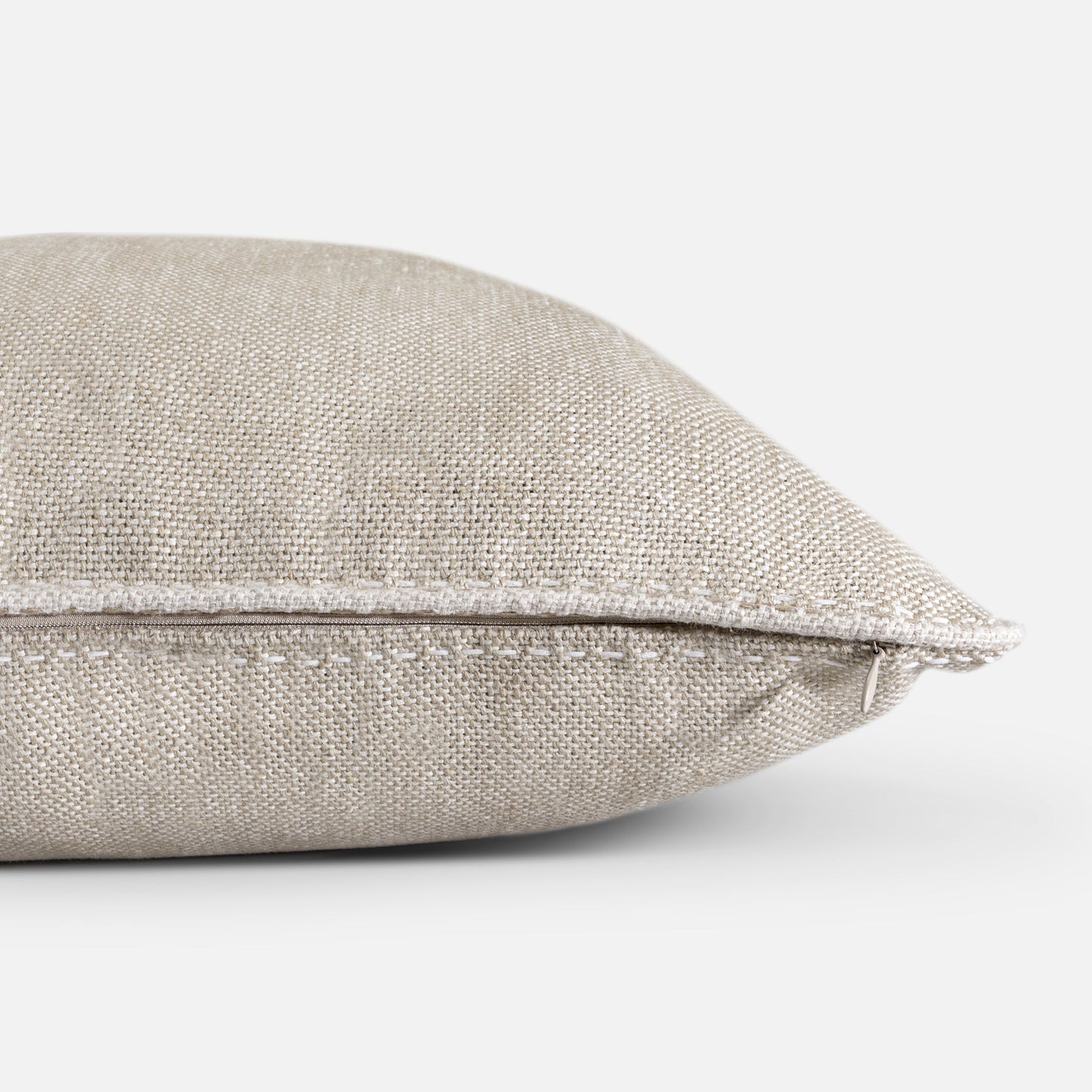 Close-up of linen piping and seam construction on cushion