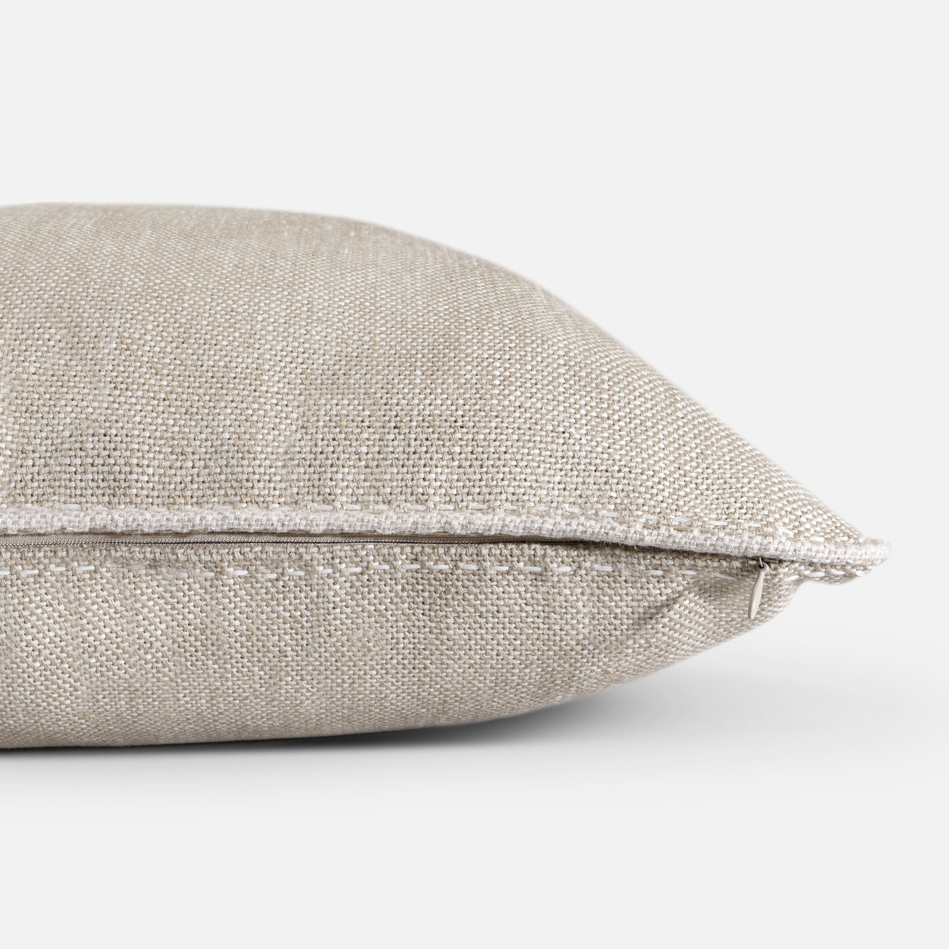 Close-up of linen piping and seam construction on cushion