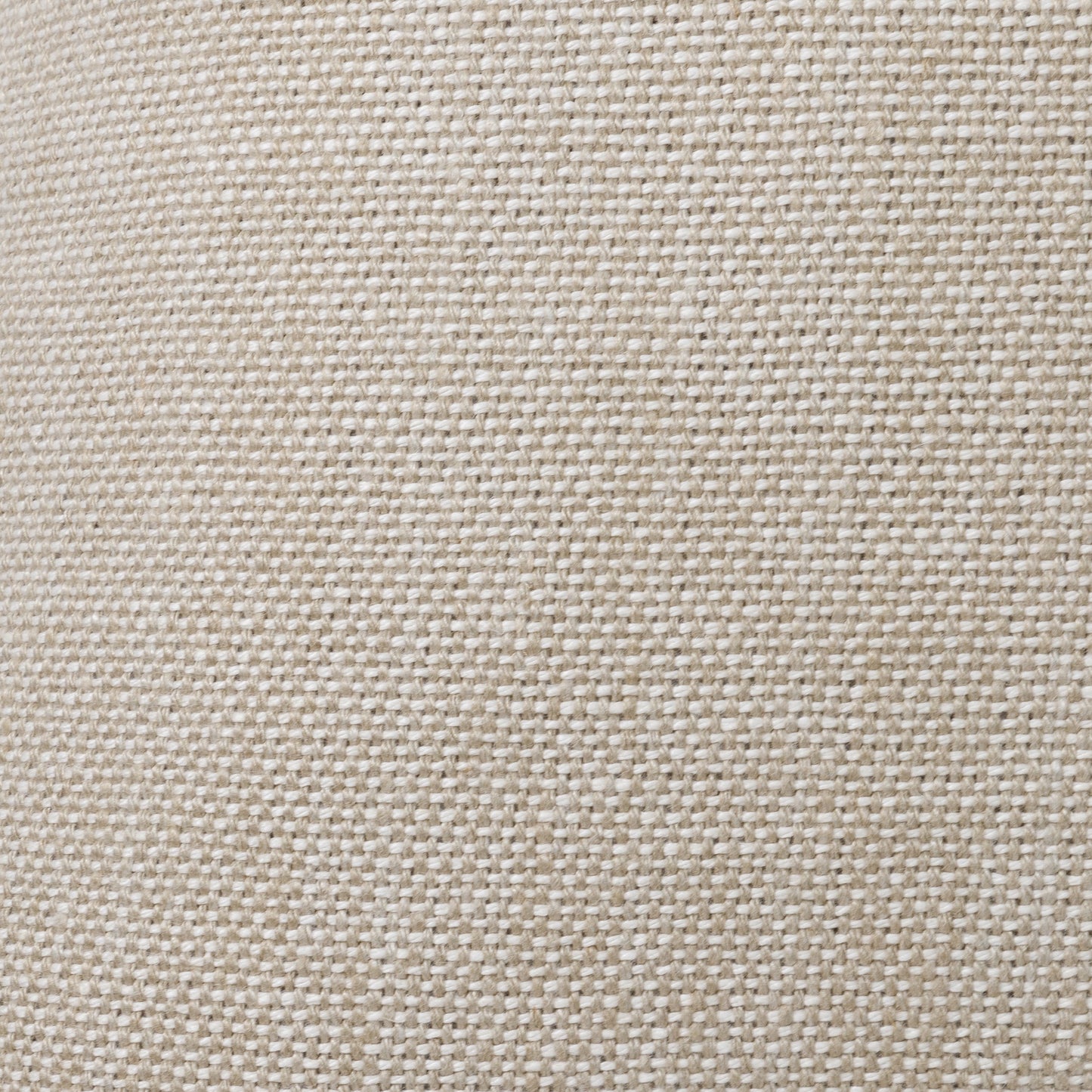 Textured natural fabric cushion with tonal stitching