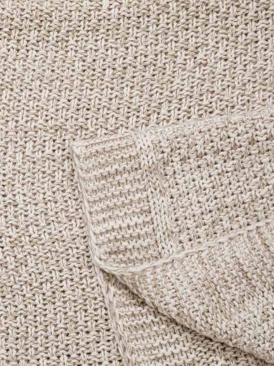 Close-up of textured grid weave on cotton blanket