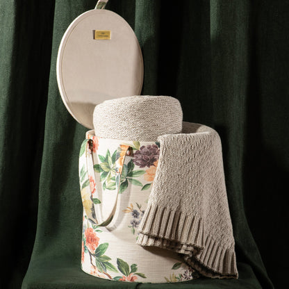 Neutral throw draped over basket