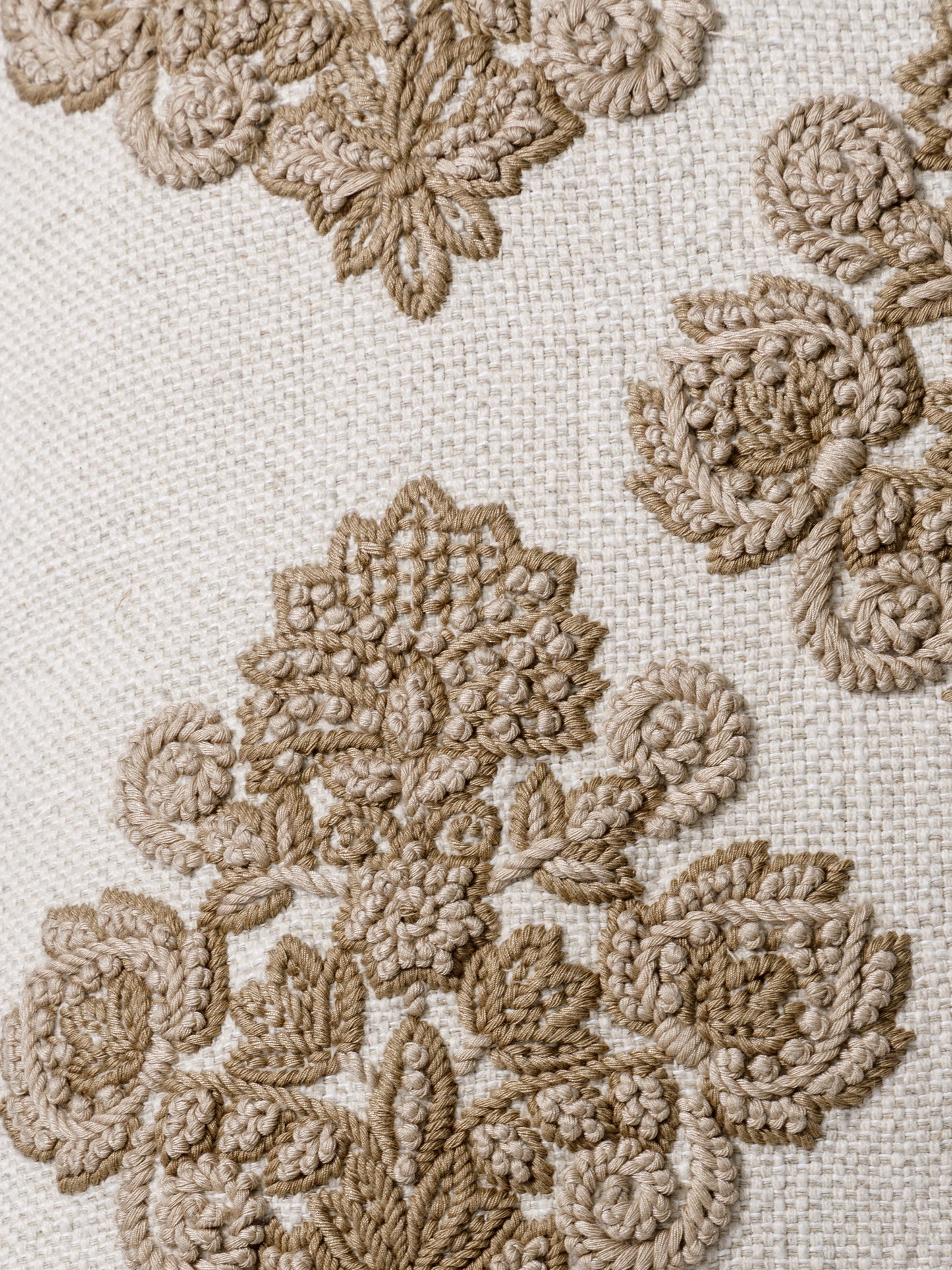 Close-up of sculpted tonal embroidery on cushion