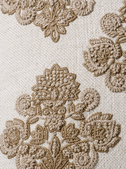 Close-up of sculpted tonal embroidery on cushion