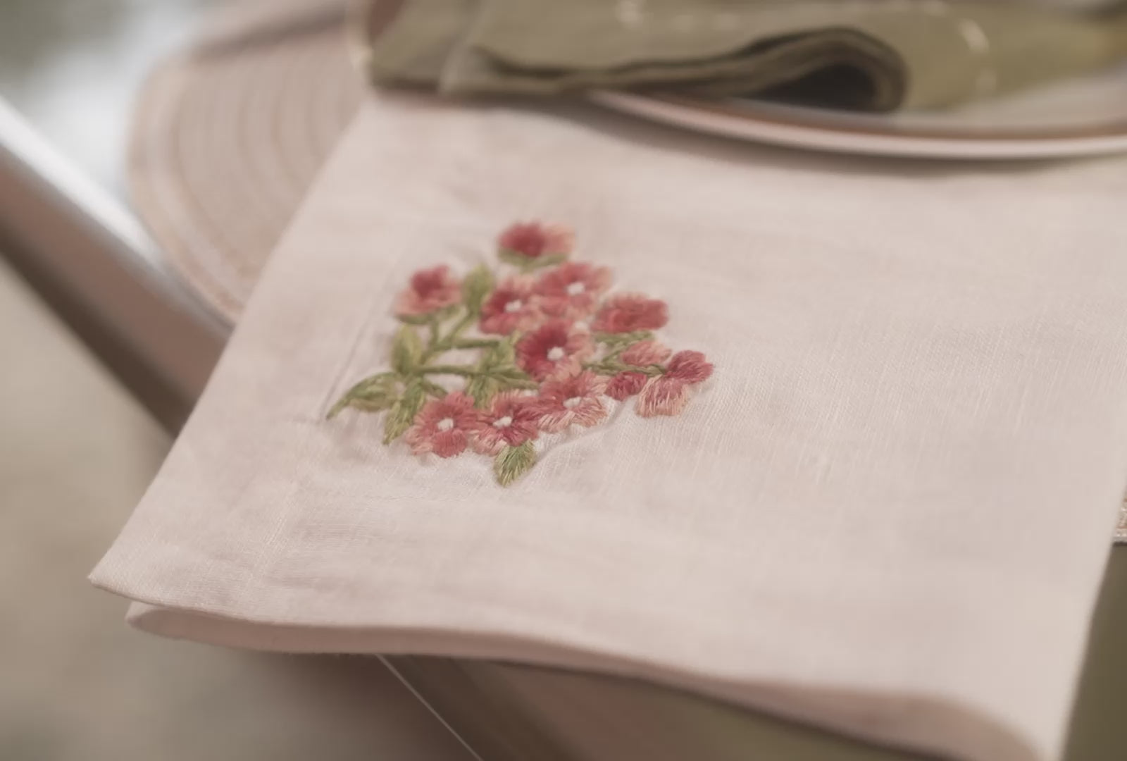 Neutral table runner with decorative embroidery styled on table